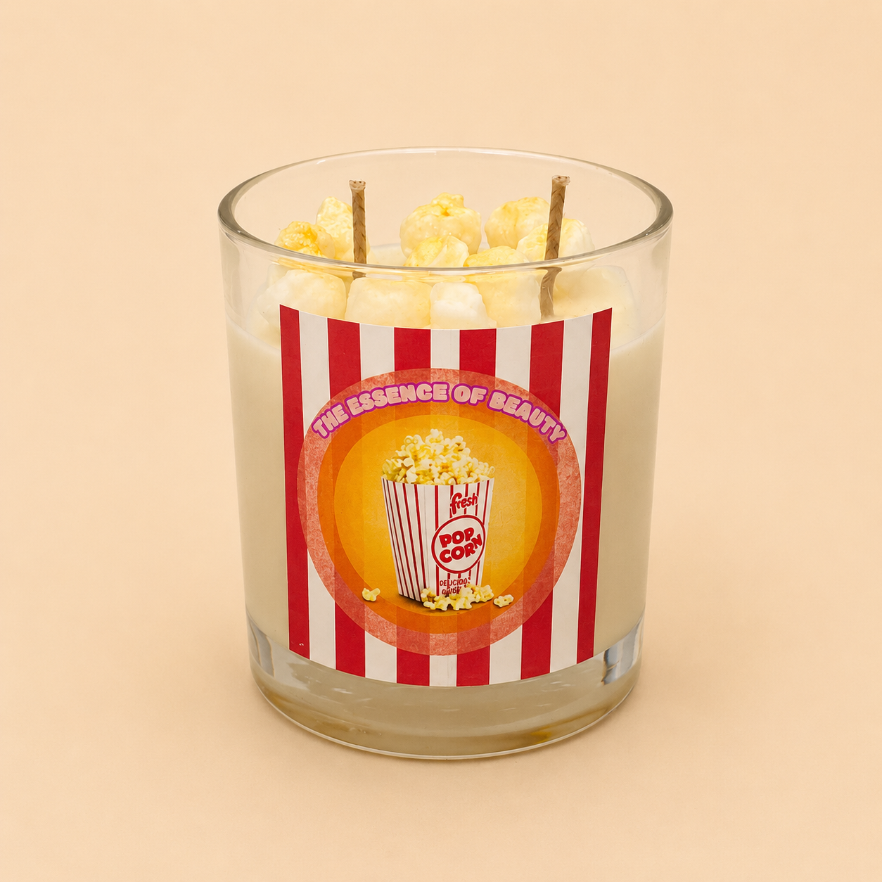 Movie Night Soy Candle by The Essence Of Beauty — buttery popcorn fragrance in a clear glass with wax popcorn topping